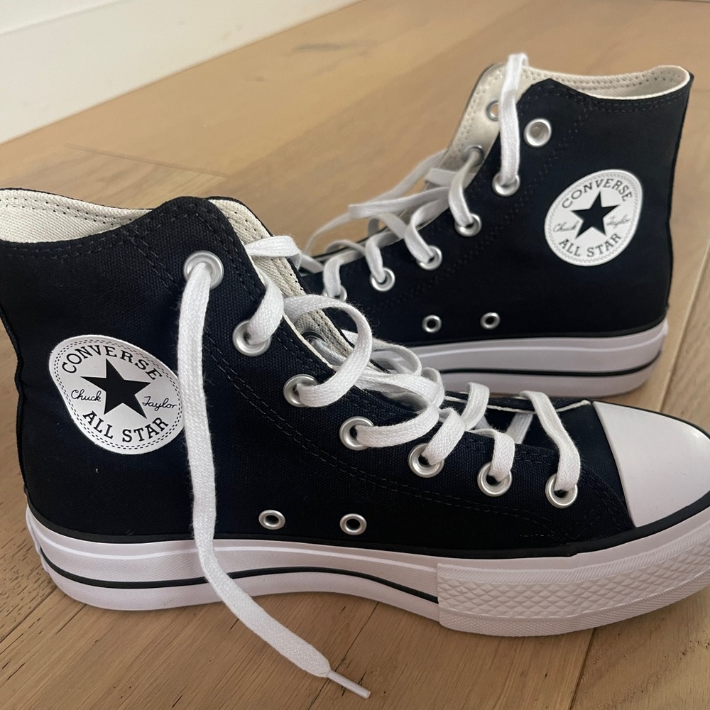 Converse high tops with interior platform sole. Never worn. Women’s 7.5 men’s 5.